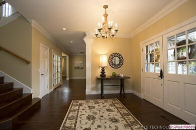 Open and bright entry waywith hardwood floors.