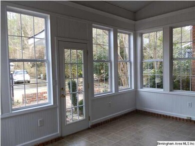 Large sunroom overlooking nicely manicured back ya