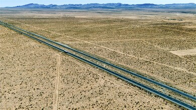 Aerial view of sparsely populated area with a dese