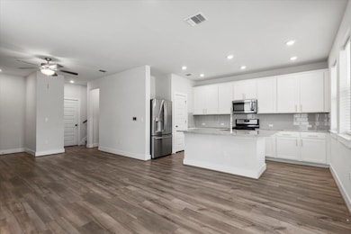 Kitchen featuring appliances with stainless steel