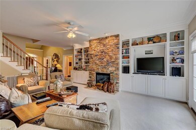Beautiful built-in shelves and cabinets on either side of the fireplace give you plenty of space for storage as well as display.