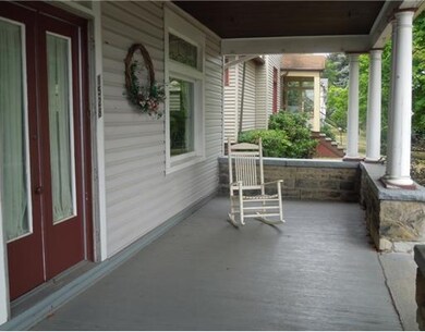 Exterior Front. Full lengh covered porch adds char