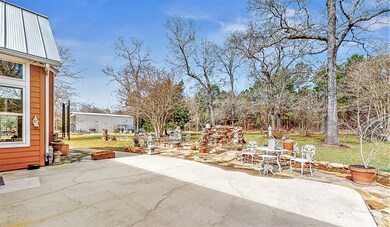 Great patio outside the primary retreat with a view of the waterfall and​​‌​​​​‌​​‌‌​​​‌​​‌‌​‌‌‌​​‌‌​‌‌‌​‌​​​‌‌​ property