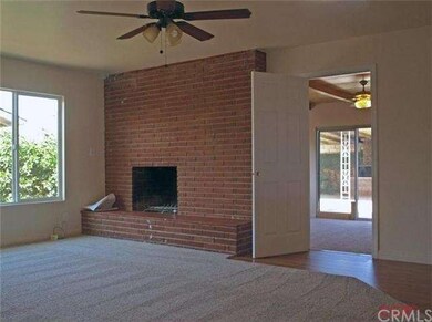 Large wood burning fireplace in living room, ceili