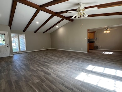 This open concept living room with attached breakfast room greets you as you come in the front door.