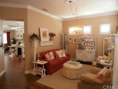 Formal living with hickory floors and crown moldin