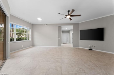 Unfurnished living room with a ceiling fan, crown molding, light tile patterned flooring, and recessed lighting