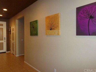 Entryway opens into lovely tile flooring.