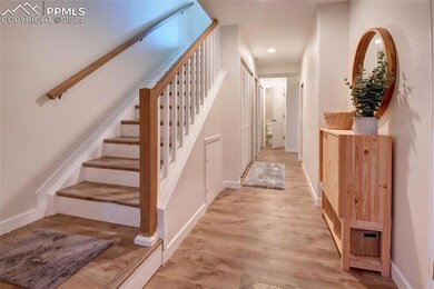 Foyer with bed and bath at end of hallway