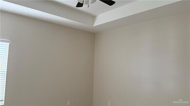 Empty room featuring ceiling fan