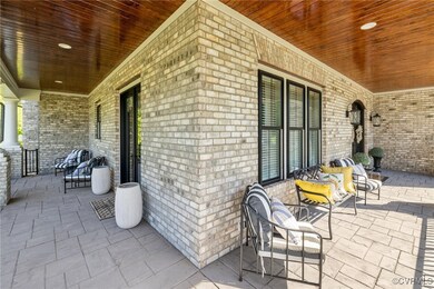 Wrap around front porch w/ french door to dining r