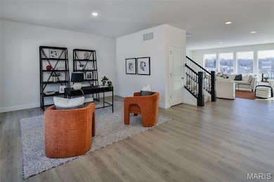 Office with recessed lighting and light wood finished floors