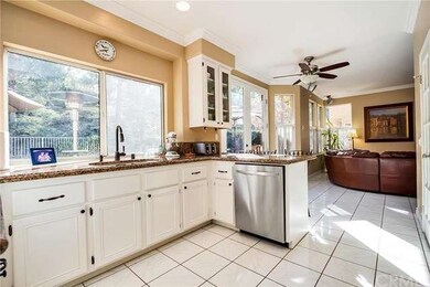 Kitchen/ Family Room boast views of the lush backy