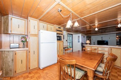 Dining room featuring ceiling fan with notable cha