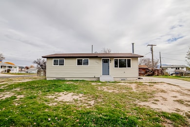 View of front of house with a front lawn and entry steps