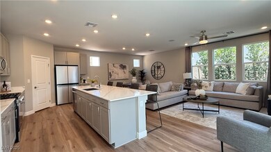 Kitchen featuring open floor plan, appliances with stainless steel finishes, gray cabinets, and recessed lighting