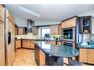Another view of the kitchen featuring a center isl