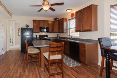 Kitchen w/island clean black appliances 