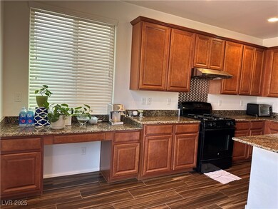 Kitchen with wood finish floors, brown cabinets, u