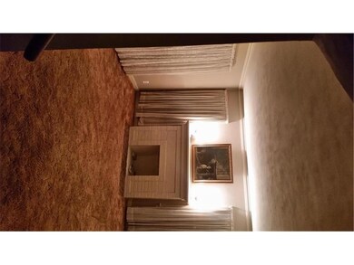 Nice size living room with lots of windows, wood b