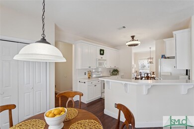 This kitchen features a cozy breakfast area, a lar