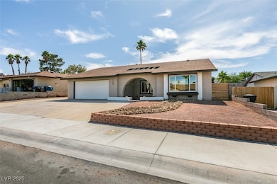 Ranch-style house featuring stucco siding, drivewa