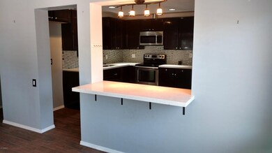 VIEW OF KITCHEN FROM FAMILY ROOM