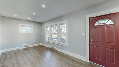 Entrance foyer featuring a healthy amount of sunlight and light hardwood / wood-style flooring