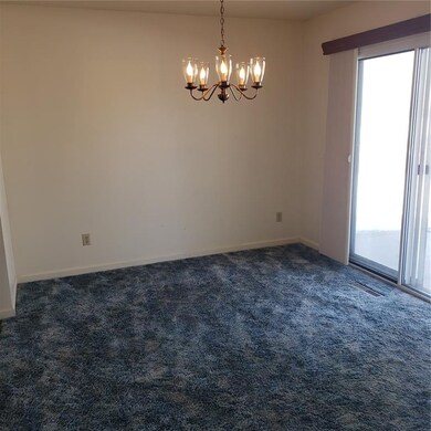 FORMAL DINING ROOM  WITH WALKOUT  TO PATIO OVER LO