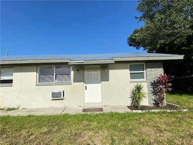 View of front of home featuring stucco siding, a f