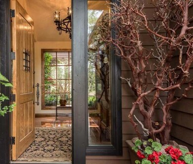 Entry foyer w/ atrium through window
