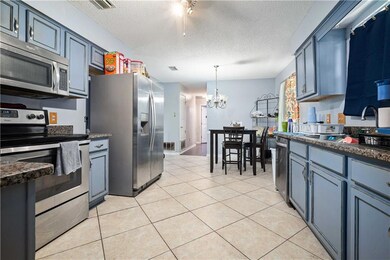 Kitchen featuring stainless steel appliances, a te