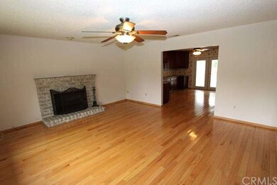 Living Room with Oak Hardwood Floor and Cozy Firep