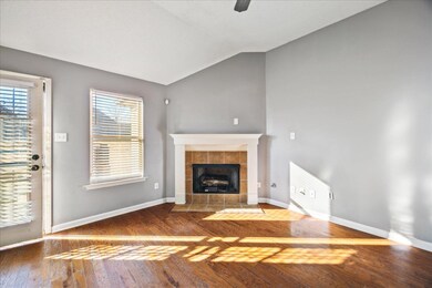 Unfurnished living room featuring vaulted ceiling,