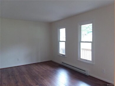 Freshly painted family room with brand new laminat
