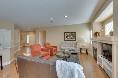 Living room featuring light wood-style flooring, r