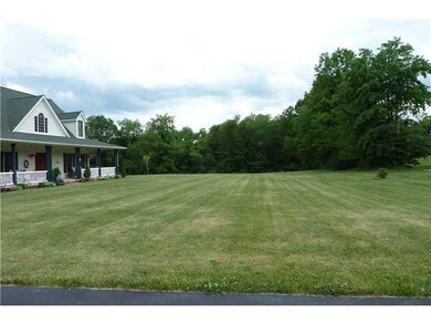Exterior Front. Green spaces all around!