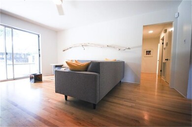LIving room, with extra wide sliding doors offering an unobstructed view of the back yard.