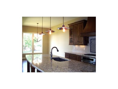 Expansive granite island supplies working space, a