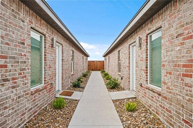 View of side of home featuring a patio area