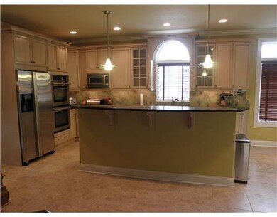 Kitchen. 2 tiered ctr island with granite and buil