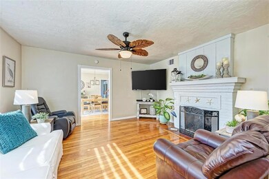 Living room with barn door to the front room