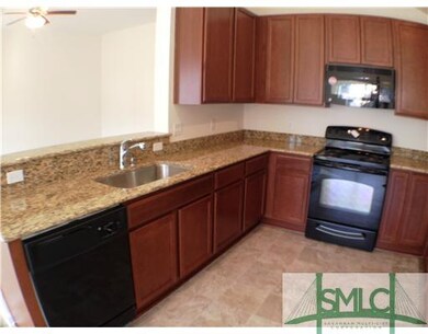 Kitchen. Beautiful Granite Countertops in this Ope