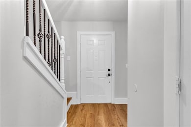 Foyer entrance with view of front door.