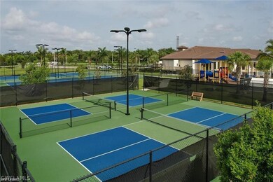 View of sport court with a playground