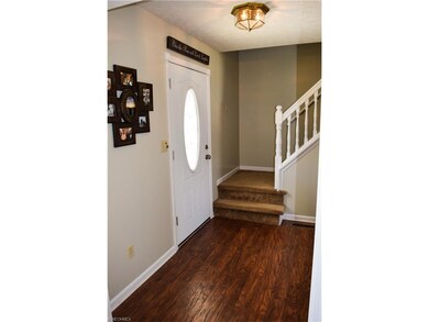 FOYER. NEW PERGO FLOORING & FRESH PAINT.