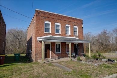 Townhome / multi-family property with brick siding