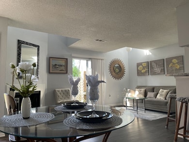 Beautifully updated condo featuring open concept living /dining room with cozy Fireplace and outside patio