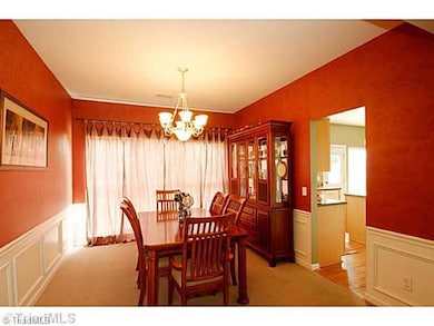 Dining Room. A rich, red faux paint treatment adds elegance to the dining space!