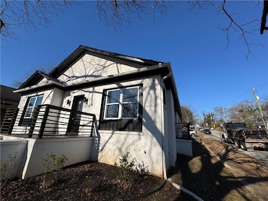 View of side of home featuring brick siding